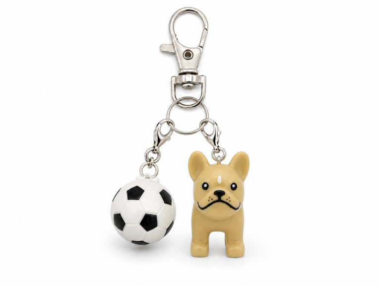 Silver zipper pull with a tan French bulldog charm and a soccer ball charm.